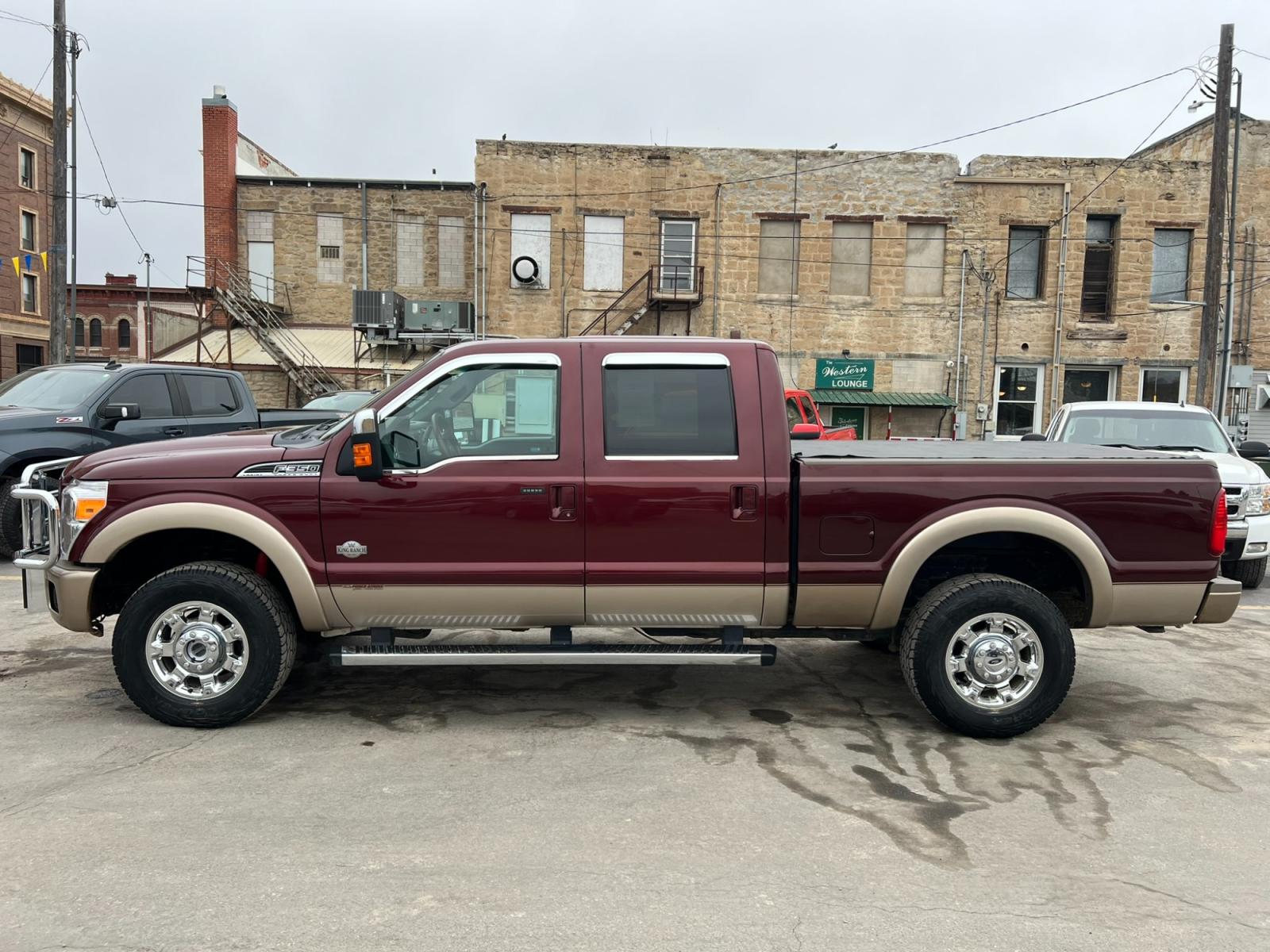 2012 Maroon /Brown Ford F-350 SD King Ranch (1FT8W3BT7CE) with an 6.7L V8 F OHV 32V DIESEL engine, Automatic transmission, located at 116 5th Avenue South, Lewistown, MT, 59457, 47.063877, -109.427879 - Introducing the ultimate combination of power and luxury – the 2012 Ford F350 Crew Cab King Ranch 4x4. With its robust Powerstroke diesel engine, this truck is built to handle anything you throw at it. Whether you're towing a trailer or cruising around town, the F350 delivers top-notch performance - Photo #5